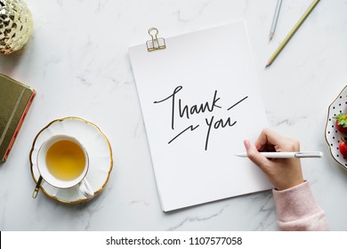 Woman Writing A Thank You Note