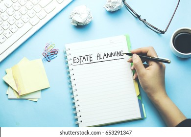 woman written estate  planning text on paper