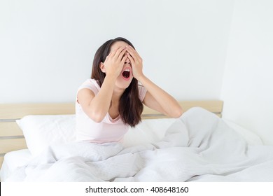 Woman Yawning At Bed