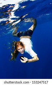 Woman Yelling At Phone In Water 