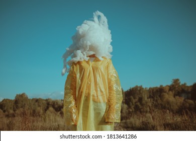 woman in a yellow cloak with a cloud instead of a head
