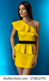 Woman In Yellow Dress On Blue Background