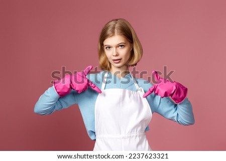 woman in yellow rubber gloves pointing oneself with fingers