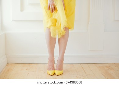 Woman In Yellow Skirt And Yellow Shoes