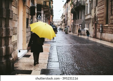 Woman With Yellow Umbrella Is Back On The Streets Of Verona