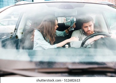 Woman Yells At Man In Car. Good Photo