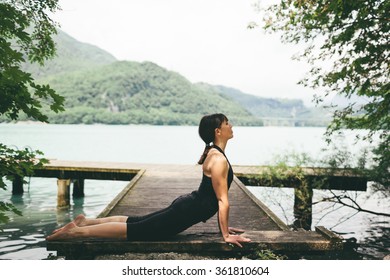 Woman Yoga Exercises Outdoor