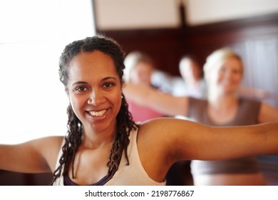 Woman In Yoga Fitness Studio, Exercise Pilates In Training Class And Wellness Motivation. Black Lady Happy Workout, Muscle Floor Stretching In Group Gym Class And Coach Practice Self Care Together