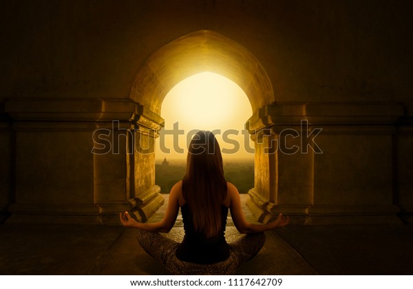 Wall mural of a woman with yoga pose in Buddhist Temple