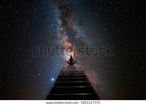 Woman in yoga pose at top of\
stair