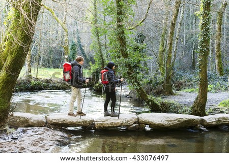 woman and young pilgrims  near the Palas de Rei village in Way of St James,  Camino de  Santiago, to Compostela, Galicia, Spain