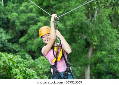 Woman Zipline Flight In Thai Jungle