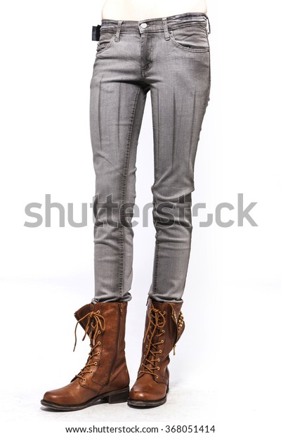 brown boots with grey pants