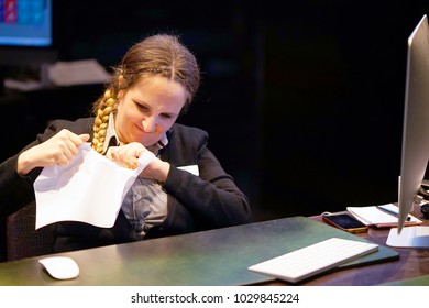 A Woman-reception Hotel Worker Reading Negative News In Letter. Shocked Beauty Girl Business Manager Received Layoff Message Letter From Company Feeling Surprised. An Agitated Girl Without Joy.