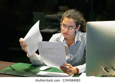 A Woman-reception Hotel Worker Reading Negative News In Letter. Shocked Beauty Girl Business Manager Received Layoff Message Letter From Company Feeling Surprised. An Agitated Girl Without Joy.