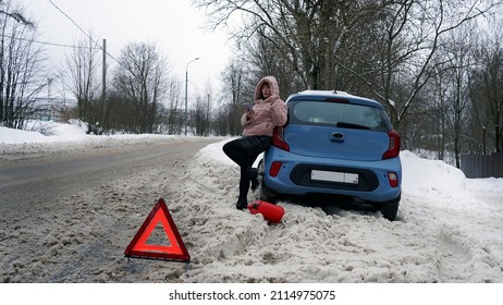 
The Woman's Car Broke Down On The Road And She Is Waiting For Help