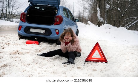 The Woman's Car Broke Down On The Road And She Is Waiting For Help