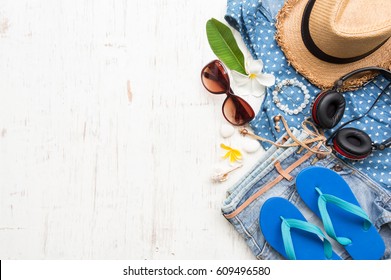 Woman's Casual Summer Clothes With Accessories Items On White Rustic Wooden Board Background, Overhead Top View, Flay Lay