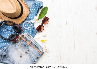 Woman's Casual Summer Clothes With Accessories Items On White Rustic Wooden Board Background, Overhead Top View, Flay Lay