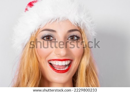 woman's face with christmas cap and cute expression