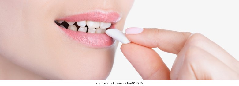 Womans Face And Female Hand Putting Into Mouth Chewing Gum