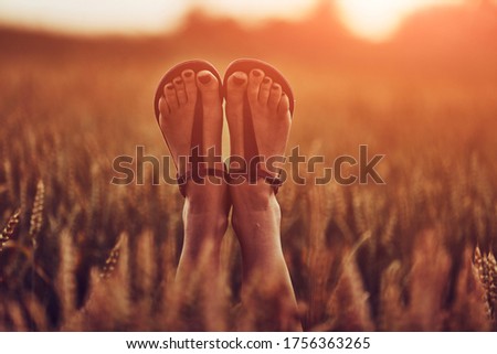 Similar – Image, Stock Photo Women’s summer shoes and hat for beach holidays