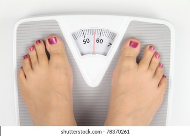 Woman's Feet On Bathroom Scale