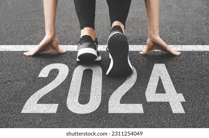 Woman's feet ont the road, begin to run, fstart of New year 2024, planning, goal, and new year resolution.