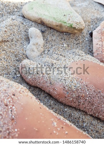Woman's foot in the sand