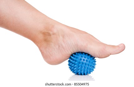 Woman's Foot With Spiny Plastic Blue Massage Ball Isolated On White Background