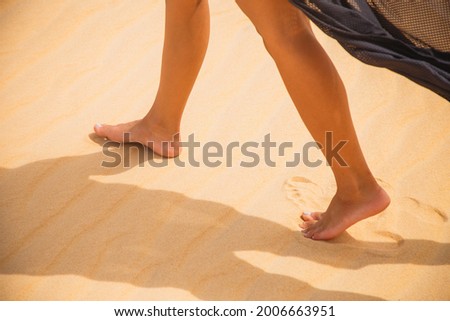 woman's foot walking in the desert