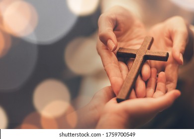 Woman's hand with cross .Concept of hope, faith, christianity, religion, church online. - Shutterstock ID 1759700549