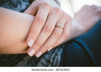 Woman's hand and a engagement ring on her finger - Shutterstock ID 687423022