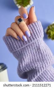 Womans Hand With Fashionable Purple Manicure. Spring Nail Design