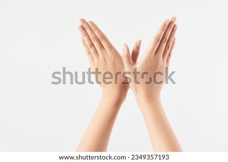 A woman's hand gesture separated against a white background. High-definition studio shooting