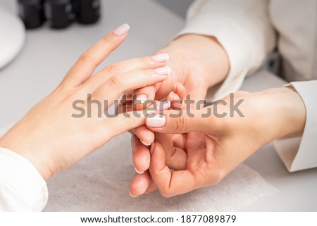 Similar – Frau in einem Nagelsalon, die eine Maniküre mit Nagelfeile erhält.