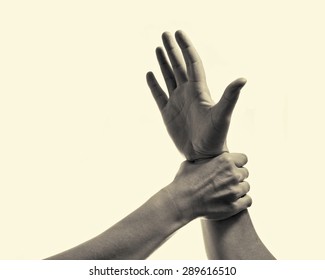 Woman's Hand Gripping His Hand Stopping Male Aggression