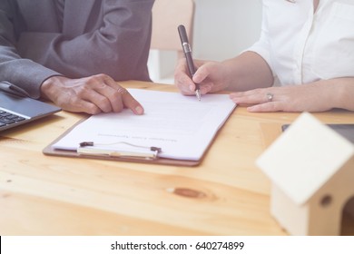 woman's hand hold ballpoint pen writing on  agreement paper sheet, fill in document template, applying for mortgage loan - Shutterstock ID 640274899