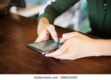 woman's hand holding digital phone and typing message. concept of shopping or planning business on touchphone. Businesswoman using wireless device. - Shutterstock ID 2086314505