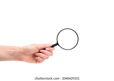 Woman's hand, holding magnifying glass, closeup isolated on white background, copy space for your image or text - Shutterstock ID 2040429251