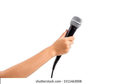 Woman's hand holding a microphone isolated on white background