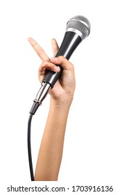 Woman's hand holding a microphone isolated on white background, clipping path 