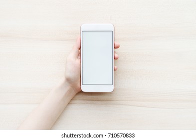 Woman's Hand Holding A Modern Phone. Blank Screen