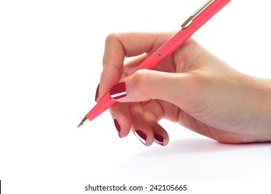 Woman's Hand Holding A Pen Isolated On White Background