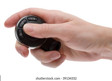 A Woman's Hand Holding The Remote Key Fob For A Modern Automobile