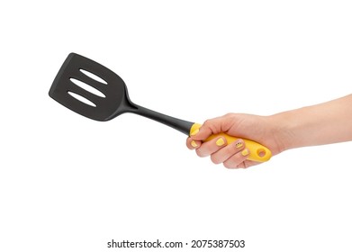 Woman's Hand Holding Spade For Frying Pan. Isolated On White.