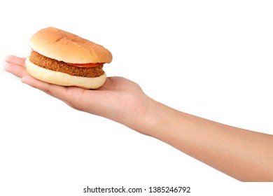 Woman's Hand Holding Tasty Burger Isolated On A White Background.