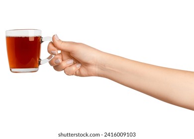 A woman's hand holds a cup of black tea with bergamot in a transparent glass cup. On a blank background - Powered by Shutterstock
