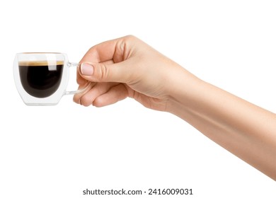 A woman's hand holds a transparent cup with double glass and coffee on a blank background.