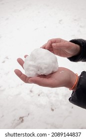 Woman's Hand Making Snowball In Park